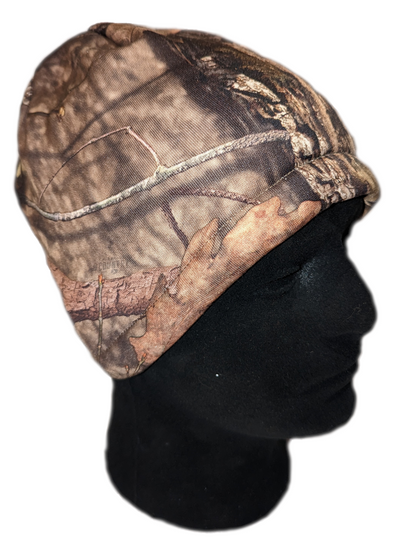 Verminator Camouflage-patterned beanie on a black mannequin head against a white background
